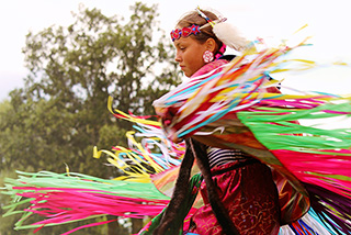 A young indigenous dancer preforming at Lower Fort Garry National Historic Site.